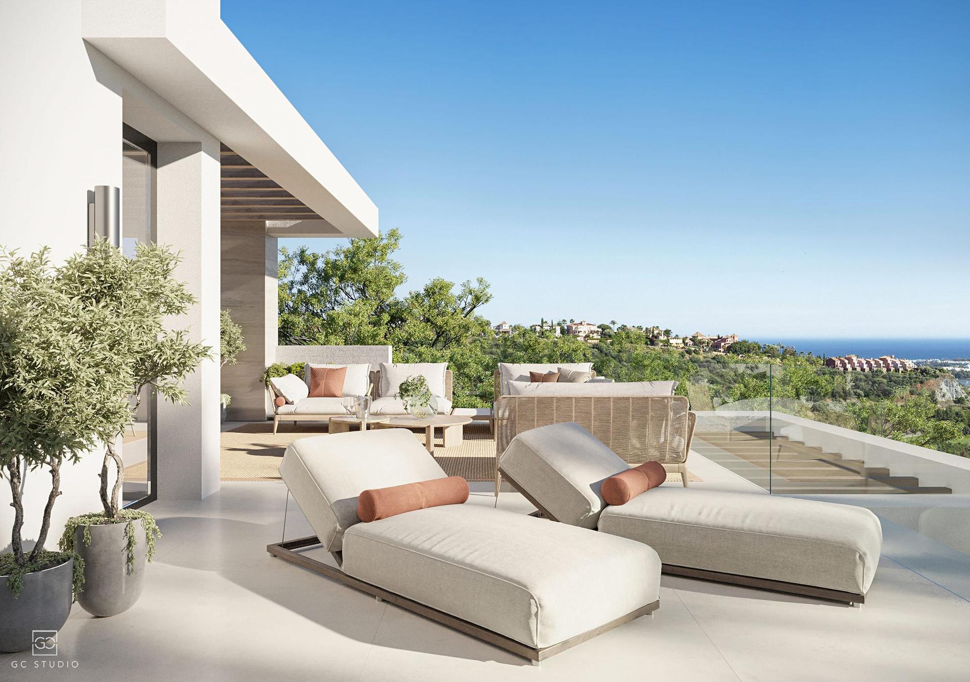 Rooftop solarium with sun loungers and sea views
